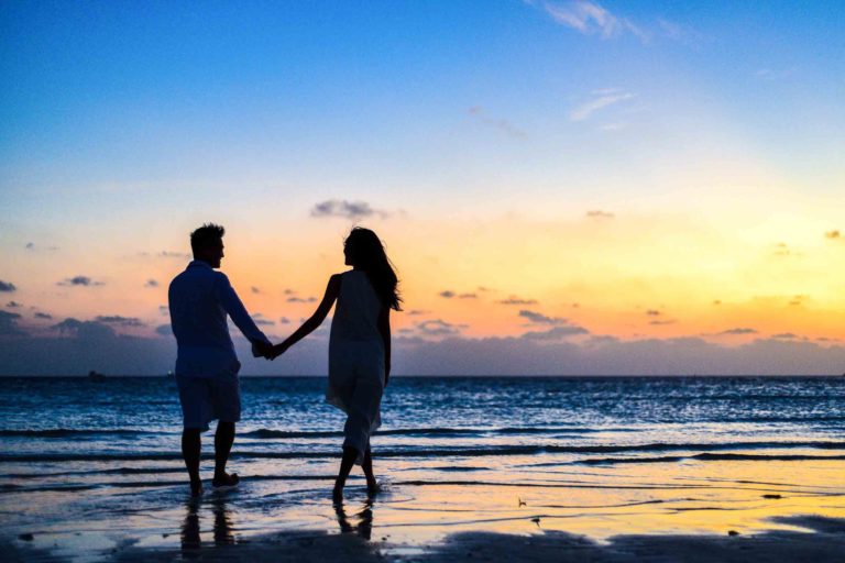 couple walk on the beach